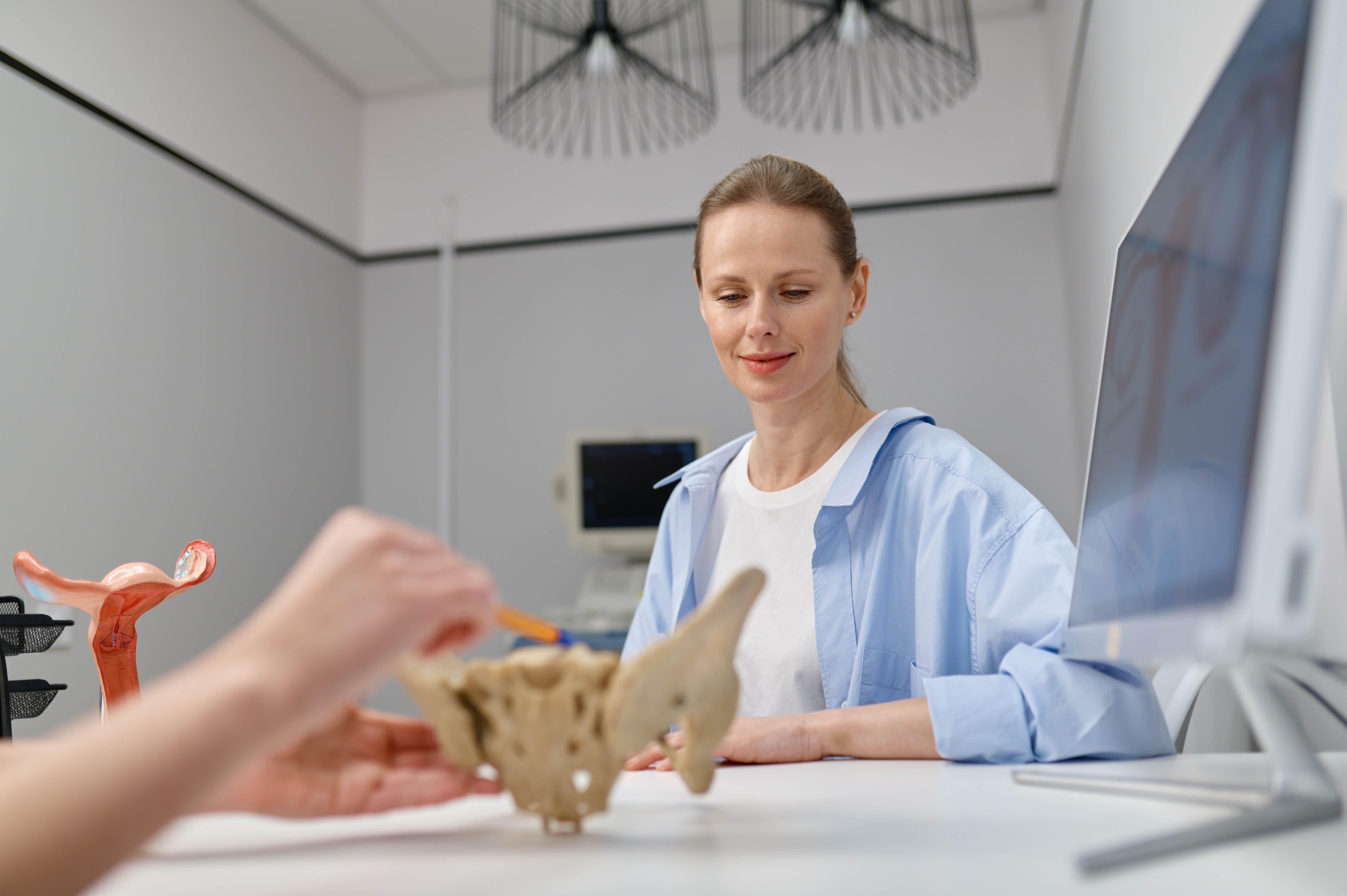 Woman receiving a pelvic health assessment with her pelvic health physiotherapist Woman receiving a pelvic health assessment with her pelvic health physiotherapist
